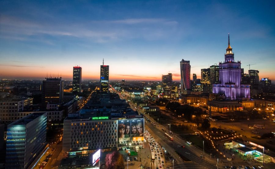 Palace of Culture and Science at night. Commercials and high buildings.