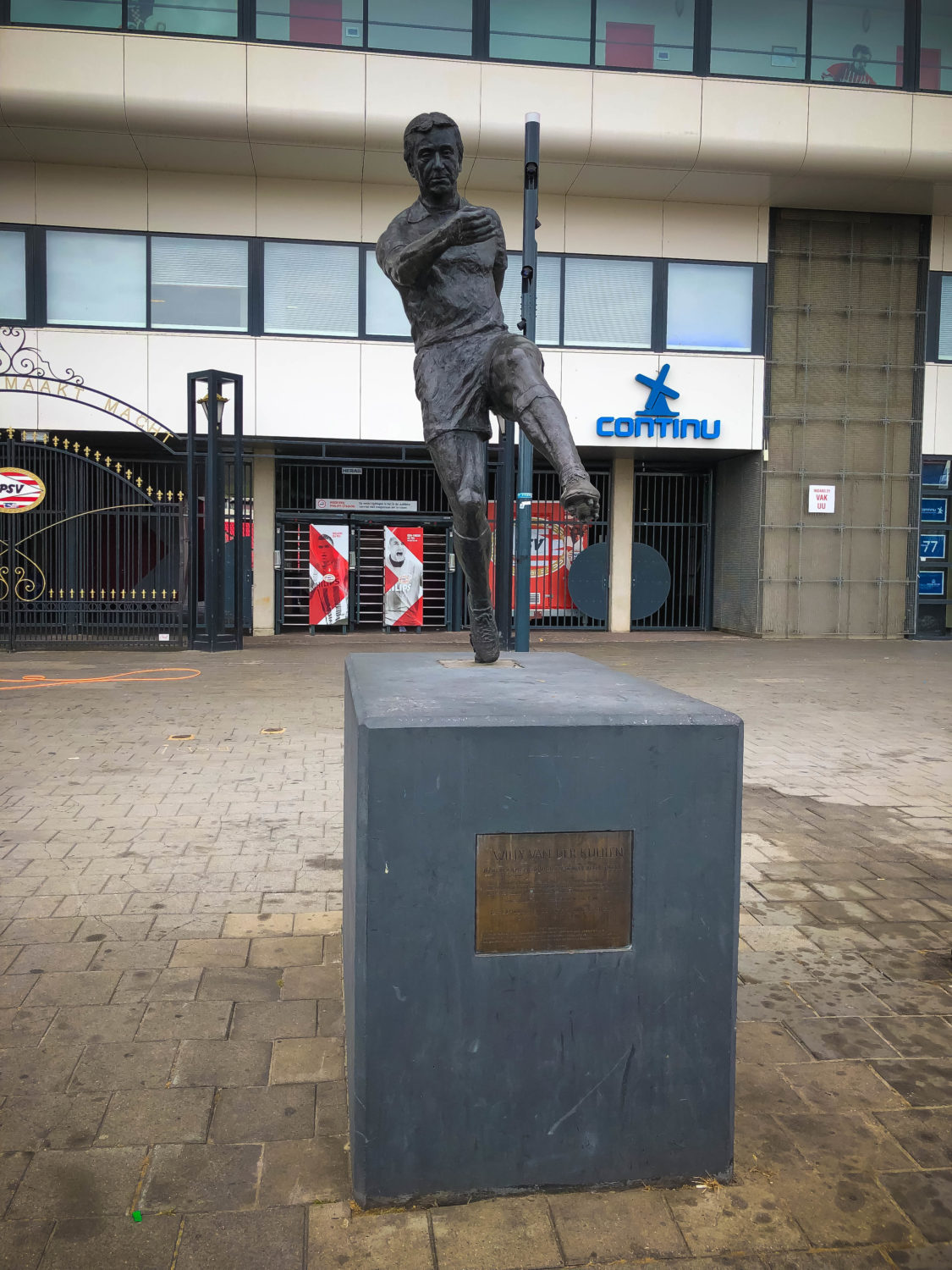 Football player statue in front of the stadium in the Netherlands