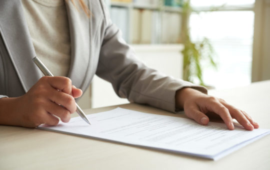 Signing documents regarding the legalization of a foreigner's stay in Poland